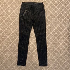 Black leather jeans with detail on front of leg